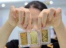 Trung Quốc lại phá giá nhân dân tệ, vàng tăng giá trở lại