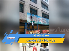 Giải cứu bé trai treo lơ lửng trên bảng hiệu