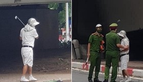 Phớt lờ Chỉ thị 16, người đàn ông vô tư ra gầm cầu vượt để… đánh golf