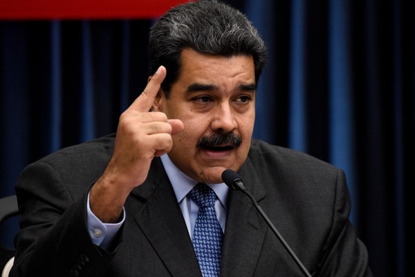 Có thông tin Nga đưa lính đánh thuê đến tăng an ninh cho ông Maduro. Ảnh: AP