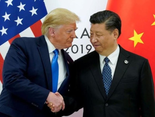 Tổng thống Mỹ Donald Trump (trái) xác nhận sắp cùng Chủ tịch Trung Quốc Tập Cận Bình (phải) ký thỏa thuận giai đoạn 1 của thỏa thuận thương mại. Ảnh: REUTERS