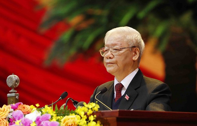 Tổng Bí thư Ban Chấp hành Trung ương Đảng, Chủ tịch nước CHXHCN Việt Nam Nguyễn Phú Trọng đọc Báo cáo chính trị của Ban Chấp hành Trung ương Đảng khóa XII và các văn kiện trình Đại hội. Ảnh: TTXVN