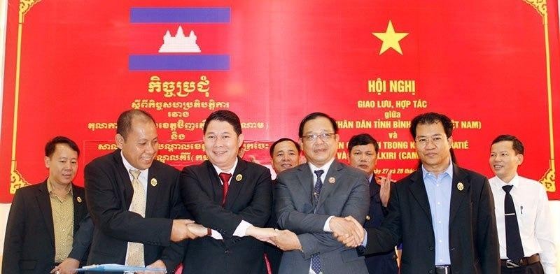 TAND Bình Phước giao lưu với tòa án 3 tỉnh Campuchia - ảnh 1